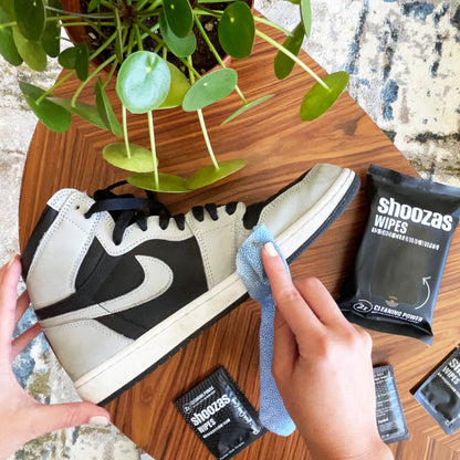 Person Using Shoozas Shoe Wipe to Clean Sneaker Sole